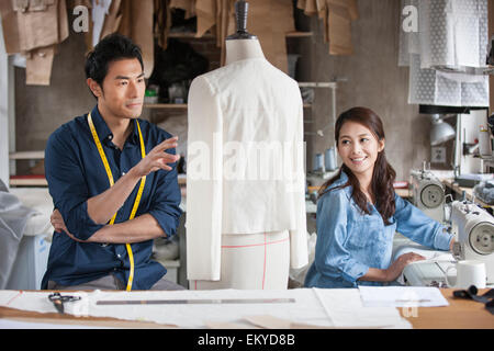Two fashion designers working in studio Stock Photo