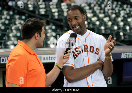 Houston, Texas, USA. 14th Apr, 2015. Former Houston Rockets guard and NBA All-Star Tracy McGrady talks with the in-stadium host before throwing out the first pitch prior to the MLB regular season game between the Houston Astros and the Oakland Athletics from Minute Maid Park in Houston, Texas. Credit:  csm/Alamy Live News Stock Photo