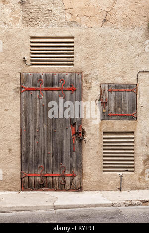 Rustic wooden door in the South of France Stock Photo