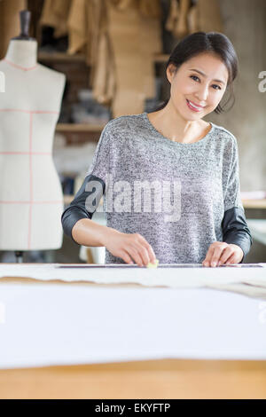 Fashion designer working in studio Stock Photo