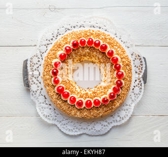 Frankfurt crown cake with cherries on white wooden. Stock Photo