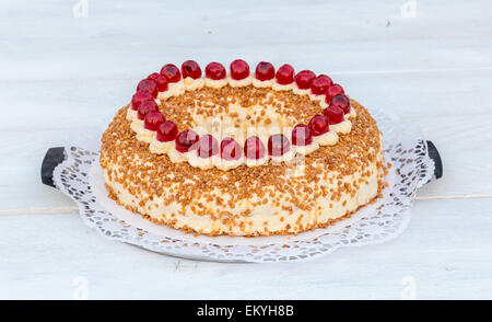 Frankfurt crown cake with cherries on white wooden. Stock Photo