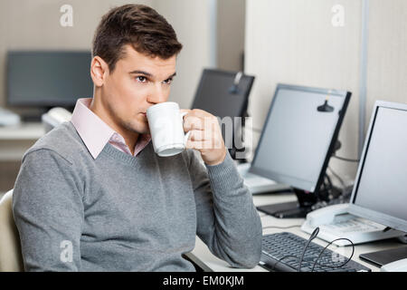 Customer Service Representative Having Coffee Stock Photo