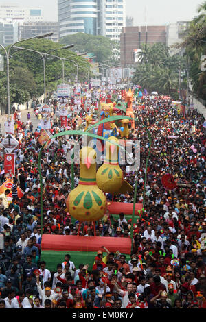 Dhaka, Bangladesh. 14th April, 2015. Revellers attend a rally in celebration of the Bengali New Year or “Pohela Boishakh” in Dhaka on April 14, 2015. The Bengali calendar or Bangla calendar is a traditional solar calendar and the year begins on Pohela Boishakh, which falls on April 14 in Bangladesh. Credit:  Mamunur Rashid/Alamy Live News Stock Photo