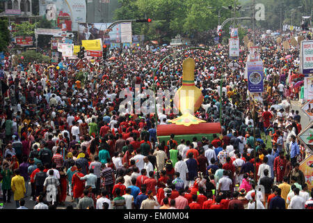 Dhaka, Bangladesh. 14th April, 2015. Revellers attend a rally in celebration of the Bengali New Year or “Pohela Boishakh” in Dhaka on April 14, 2015. The Bengali calendar or Bangla calendar is a traditional solar calendar and the year begins on Pohela Boishakh, which falls on April 14 in Bangladesh. Credit:  Mamunur Rashid/Alamy Live News Stock Photo