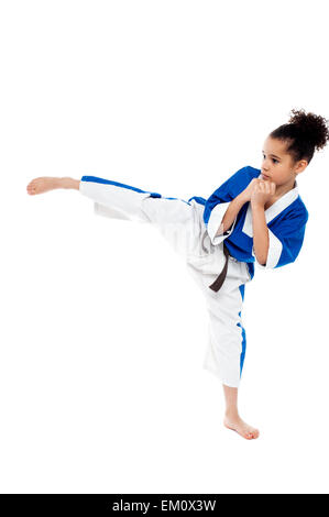 Small kid practicing karate kick Stock Photo