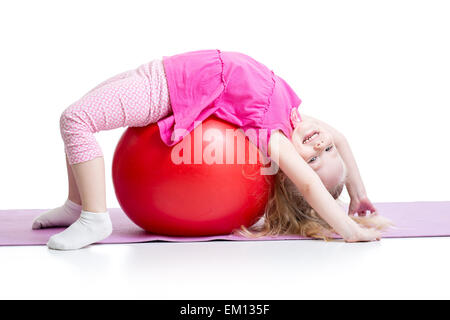 Cute kid girl stretching on pilates ball Stock Photo