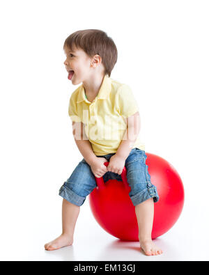 happy child jumping on bouncing ball Stock Photo