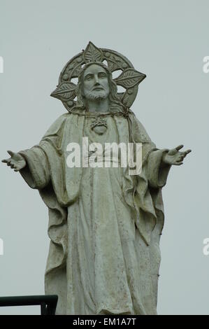 A statue of Jesus Christ with outstretched arms in People's Park in the Sky, Tagaytay, The Philippines Stock Photo