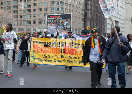 New York, NY - April 14, 2015: Protesters against police brutality walk down around Foley Square Stock Photo