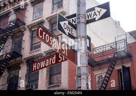 Street signs in the cast iron district of Soho in New York City. Street signs are brown in SoHo. Stock Photo