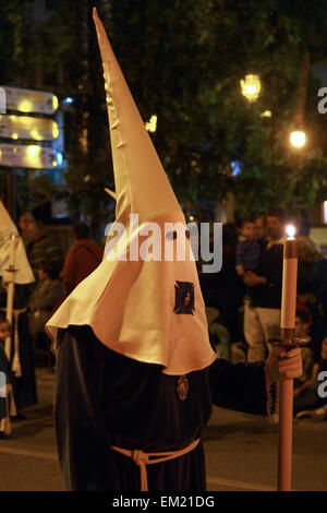 Penitent in traditional hood and robe in an Easter parade on Holy ...