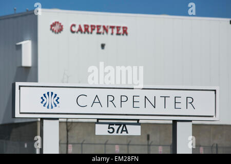 A logo sign outside of a facility operated by the cushioning products manufacturer Carpenter Ltd. Stock Photo