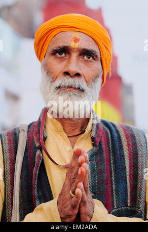 Holy man lingering the ghats of Varanasi Stock Photo