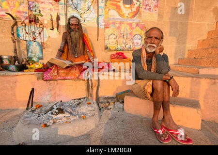 Holy man lingering the ghats of Varanasi Stock Photo