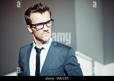 Confident young businessman in eyeglasses and formalwear Stock Photo
