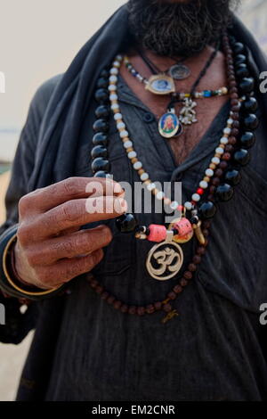 Holy man lingering the ghats of Varanasi Stock Photo