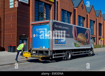 Man unloading produce from Greggs delivery van, England UK Stock Photo