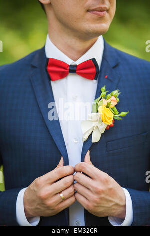 hands of groom in blue suit. unrecognizable man. groom getting ready for the wedding Stock Photo
