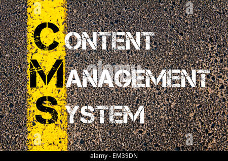 Acronym CMS - Content Management System. Business Conceptual image with yellow paint line on the road over asphalt stone backgro Stock Photo
