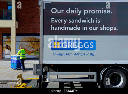 Man unloading produce from Greggs delivery van, England UK Stock Photo