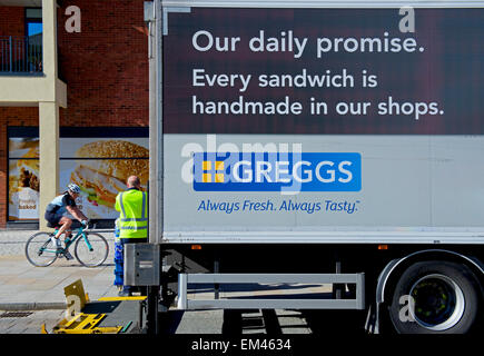 Man unloading produce from Greggs delivery van, England UK Stock Photo