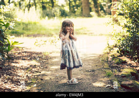 girl, daughter, light, green, blonde brown hair, smiling, happy bokeh, face pulling, forest , funny, shocked Stock Photo