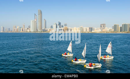 Daytime skyline view and sailing boats in Abu Dhabi in United Arab Emirates Stock Photo