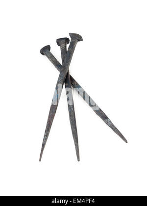 Three old wrought nails on white background Stock Photo