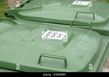 Green garden waste bins used for collecting and recycling plant and vegetable matter Stock Photo