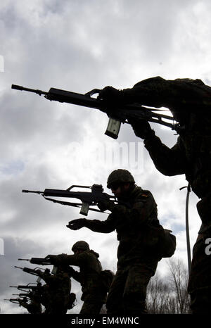 Husum, Germany. 16th Apr, 2015. Bundeswehr armed forces soldiers practice with G36 rifles during basic training in the Special Pioneer Battalion 164 in Husum, Germany, 16 April 2015. German Minister of Defence Ursula von der Leyen is visiting the battalion on Thursday and announced that the Bundeswehr wants to invest 60 million euros in the Husum site over the coming years. Photo: CHRISTIAN CHARISIUS/dpa/Alamy Live News Stock Photo