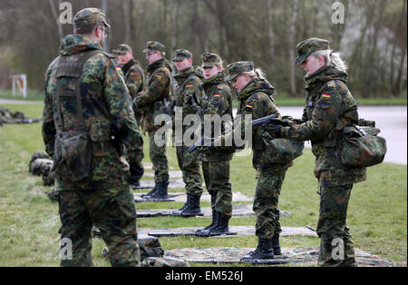 Husum, Germany. 16th Apr, 2015. Bundeswehr armed forces soldiers practice with hand guns during basic training in the Special Pioneer Battalion 164 in Husum, Germany, 16 April 2015. German Minister of Defence Ursula von der Leyen is visiting the battalion on Thursday and announced that the Bundeswehr wants to invest 60 million euros in the Husum site over the coming years. Photo: CHRISTIAN CHARISIUS/dpa/Alamy Live News Stock Photo