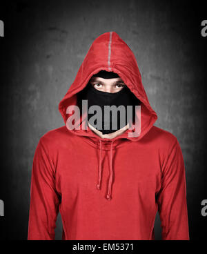terrorist with red hoodie and mask on a white background Stock Photo