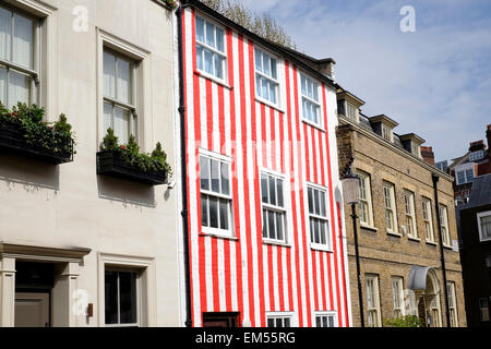 A general view of a town house painted in red and white stripes Stock Photo