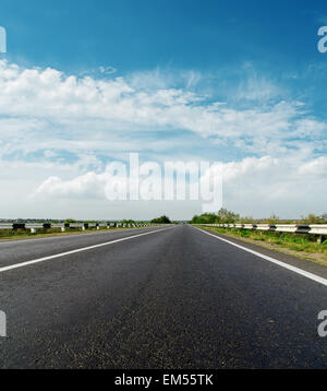 cloudy sky over asphalt road Stock Photo - Alamy