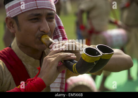 Sivasagar, Assam, India. 16th Apr, 2015. An Indian youth blows a 'Mohor Xingor Pepa' (A pipe made of buffalo horn) during Rongali Bihu celebrations in Sivasagar district of northeastern Assam state on April 16, 2015. The Rongali Bihu Festival is held in the first month of the Assamese calendar marking the begining of the Assamese New Year, which coincides with the start of spring in the Indian state of Assam. © Luit Chaliha/ZUMA Wire/ZUMAPRESS.com/Alamy Live News Stock Photo