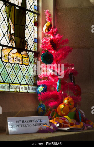 UK, England, Yorkshire, Harrogate, St Peter’s Church, pink Christmas tree on window ledge Stock Photo
