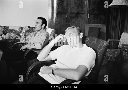 1966 World Cup The England squad at their base in Hendon where they stayed throughout the tournament. Striker Jimmy Greaves (left) smokes a pipe while captain Bobby Moore has a nap. July 1966. Stock Photo