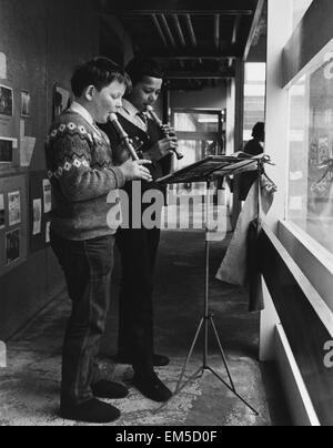 Two schoolboys playing the recorder during a music lesson at the Vittoria primary school in Islington built by the ILEA. Circa 1965. Stock Photo