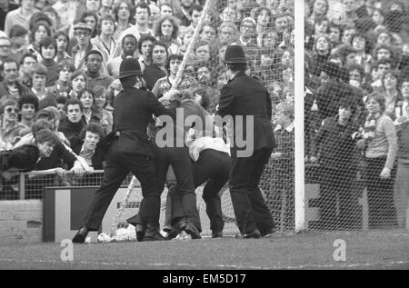 March 1978, a full-scale riot breaks out at The Den during an FA Cup quarter-final between Millwall and Ipswich. Fighting began on the terraces, then spilled out on to the pitch and into the narrow streets around the ground 11th March 1978 Our Picture show policemen making arrests Stock Photo