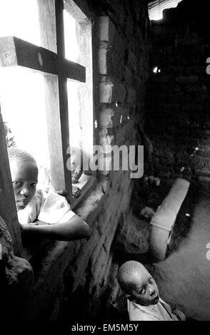 Children in a Catholic school ikutha, Kitui, Kenya. Maltreatment. Violence. Children are, as always, the most vulnerable victims of the disease. No one is free of it and less in a country with one of the highest rates in the world. In Africa some 30 million people are living with HIV, of which one third are children. AIDS, poverty and drought in rural areas of Kenya. Stock Photo