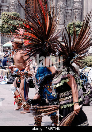 native Aztec dancers dancing performing in feathered headdress in the Zocalo, Mexico City, Mexico, North America Stock Photo