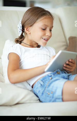 Child playing on tablet pc Stock Photo
