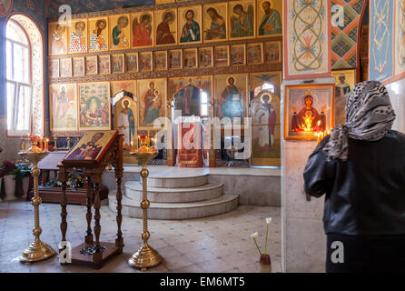 SAMARA, RUSSIA - APRIL 12, 2015: Orthodox Christians inside the Church of  Resurrection in the Holy Resurrection Monastery Stock Photo