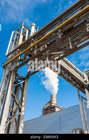 Chemical plant for the treatment of chipboard for furniture factory, with chimney Stock Photo