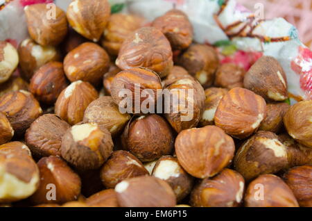 Bunch of raw hazelnuts on a plate Stock Photo