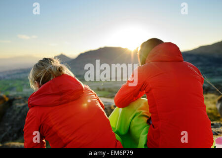Two young women looking at sunset in Macedonia. Stock Photo