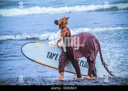 Surf in a carnival costumes, Bali, Indonesia.  Just take a fun and play with a friends. Stock Photo