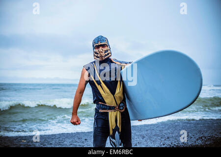 Surf in a carnival costumes, Bali, Indonesia.  Just take a fun and play with a friends. Stock Photo