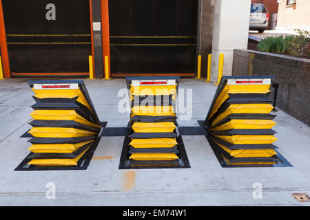 Wedge barrier vehicle barricades at US Federal building loading dock